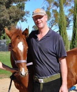 Farrier Russell Williams with a foal